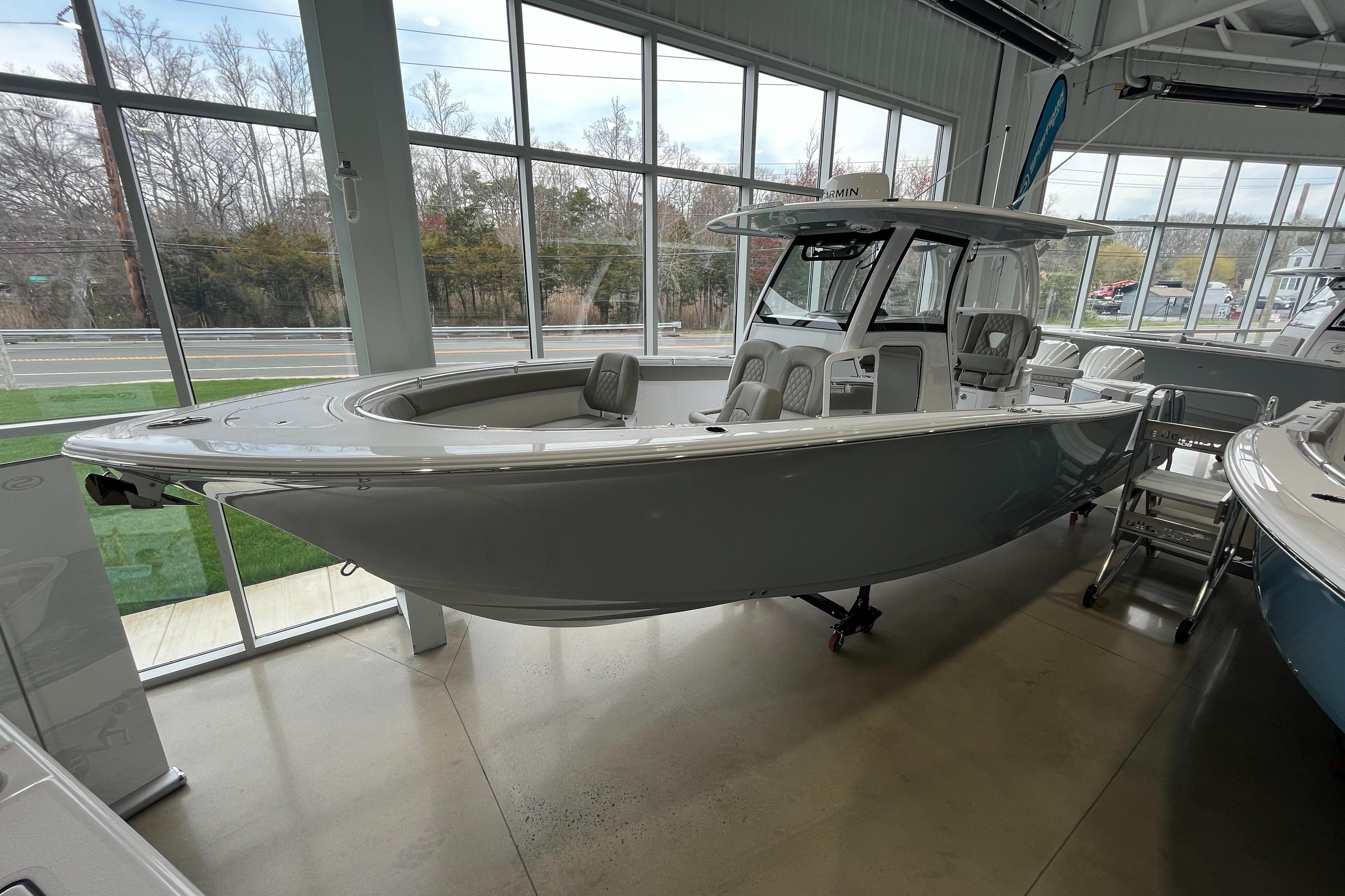 Sportsman Open 302 Center Console 2025 Sportsman Open 302 Center Console boat displayed in a showroom.