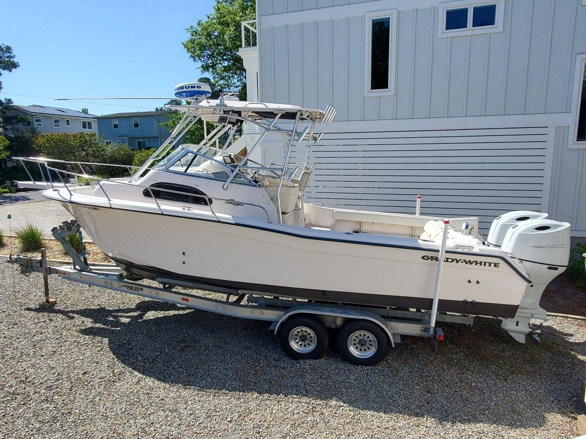 Grady-White Islander 270 2004 Grady-White Islander 270 boat on trailer, parked outdoors.