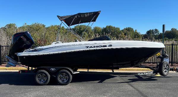 Tahoe T21 2025 Tahoe T21 boat on trailer, black and white design, parked outdoors.