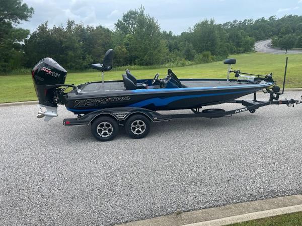 Nitro Z21 XL 2025 Nitro Z21 XL bass boat on trailer, parked on a road.