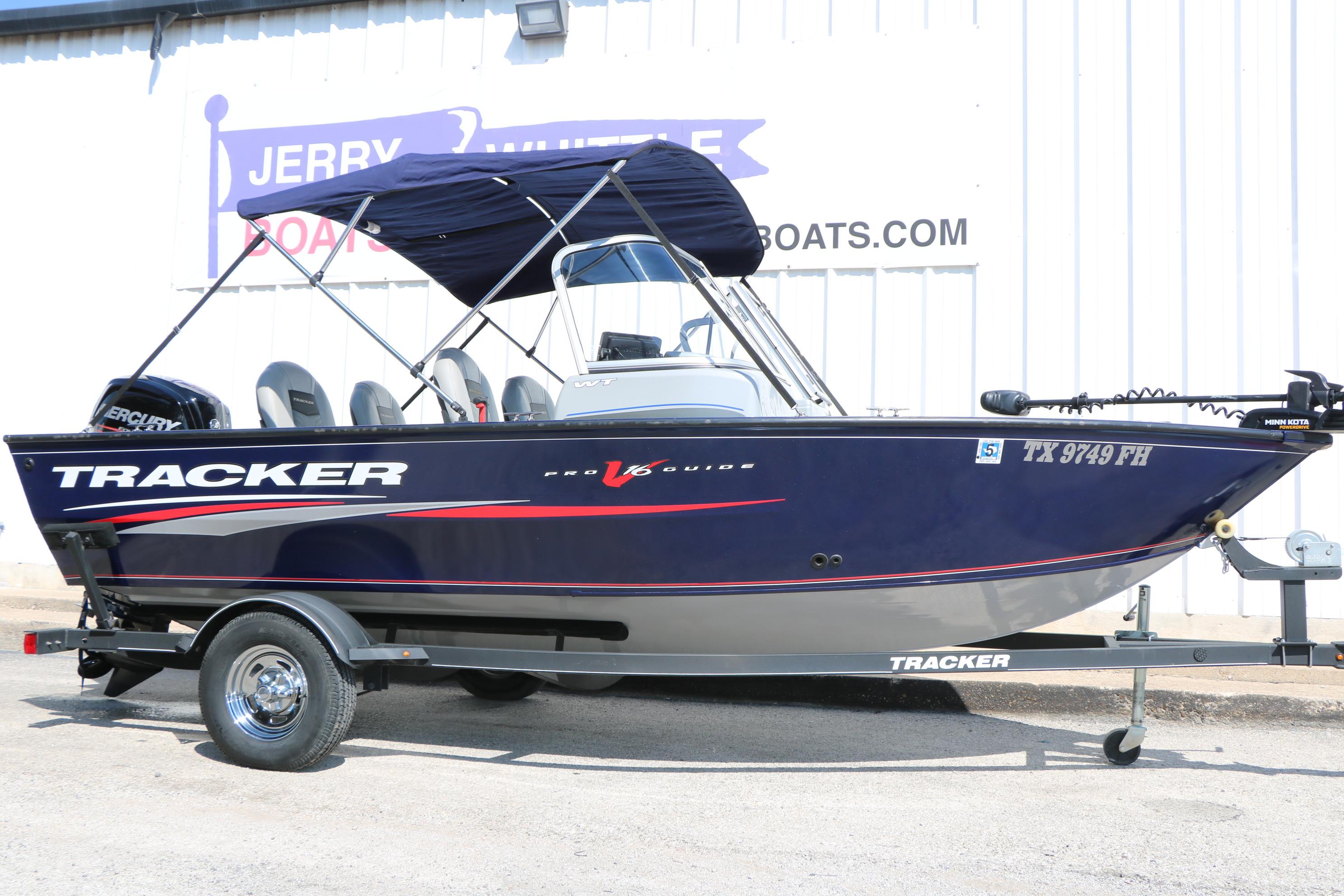 Tracker Pro Guide V-16 WT 2019 Tracker Pro Guide V-16 WT boat on trailer, parked outside dealership.