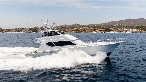 Hatteras 65 Enclosed Bridge 2004 Hatteras 65 Enclosed Bridge yacht cruising on open water.