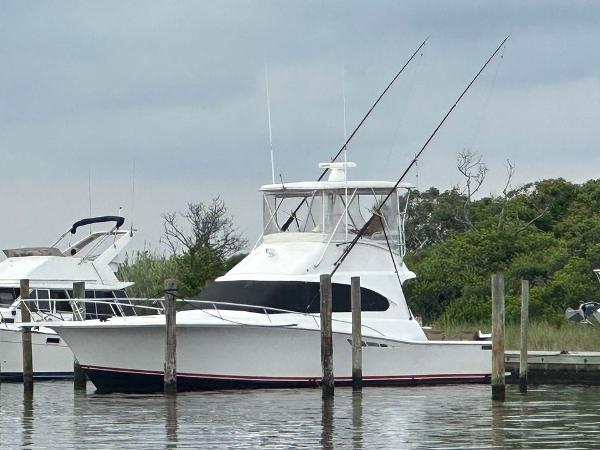 Luhrs Tournament 380 Convertible 1993 Luhrs Tournament 380 Convertible yacht docked at marina, overcast sky.