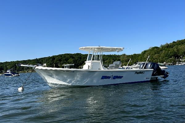 Parker 2501 Center Console 2021 Parker 2501 Center Console boat on calm water, clear blue sky.