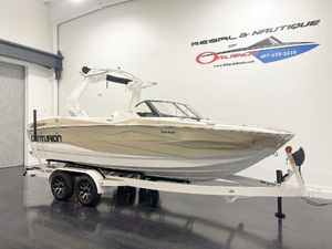 Centurion Nv213 2025 Centurion NV213 boat on trailer in showroom, side view.