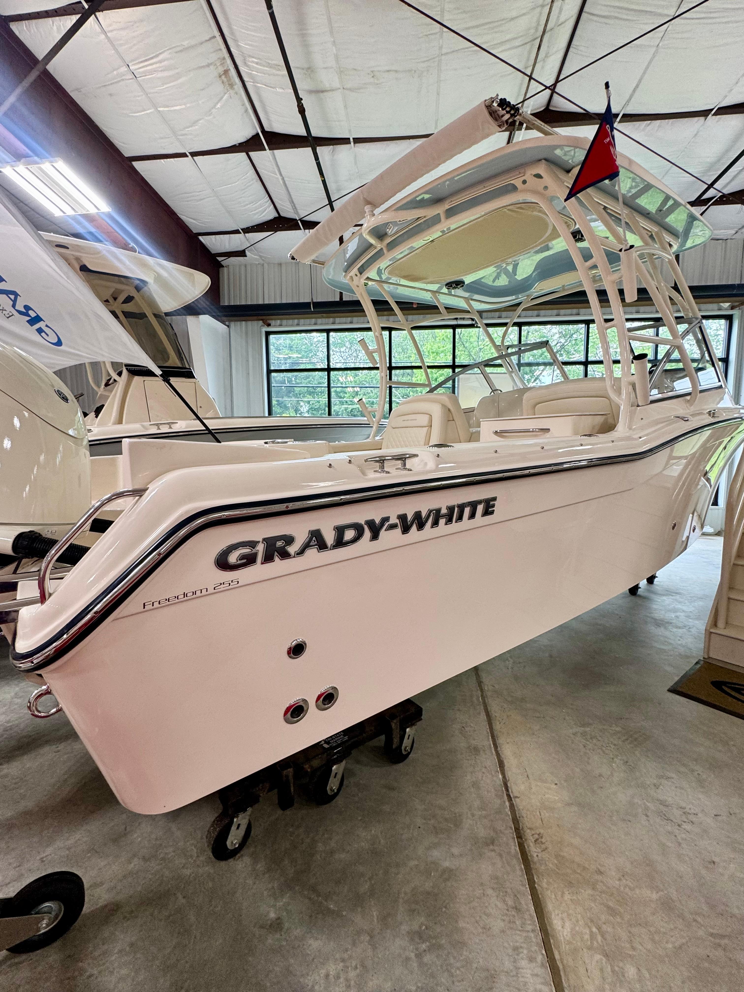 Grady-White Freedom 255 2026 Grady-White Freedom 255 boat displayed in a showroom.