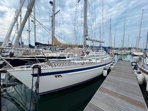 Malo 40 classic Sailboat Malo 40 Classic 2007 docked in marina with cloudy sky background.