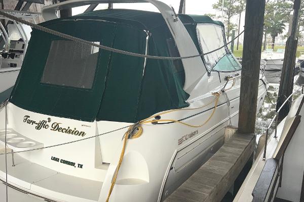 Cruisers Yachts 3575 Esprit 1997 Cruisers Yachts 3575 Esprit docked with green canopy in marina.