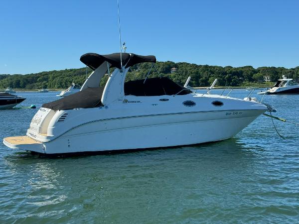 Sea Ray 260 Sundancer 2003 Sea Ray 260 Sundancer boat anchored in a scenic bay.