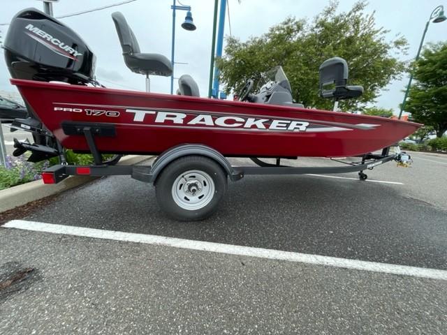 Tracker Pro 170 2025 Tracker Pro 170 boat in parking lot, red exterior, on trailer.