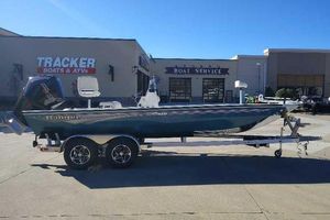 Ranger RB210 2025 Ranger RB210 boat on trailer at dealership, sunny day.