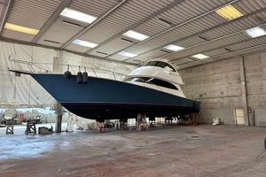 Viking 62 Enclosed Bridge 2017 Viking 62 Enclosed Bridge yacht in a spacious indoor facility.