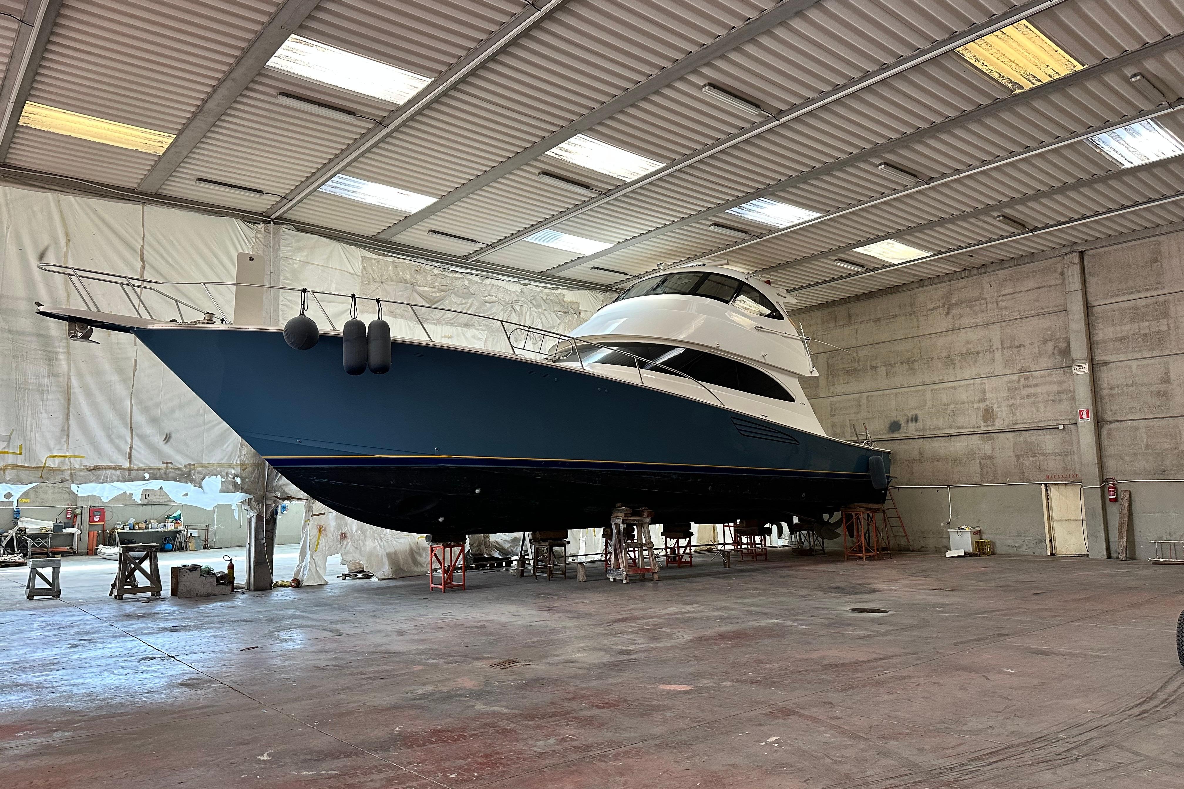 Viking 62 Enclosed Bridge 2017 Viking 62 Enclosed Bridge yacht in a spacious indoor facility.