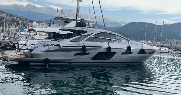 Pershing 7X 2024 Pershing 7X yacht docked in a marina with mountainous backdrop.
