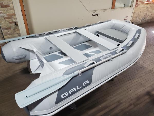 Gala A270D 2023 Gala A270D inflatable boat with oars in an indoor setting.