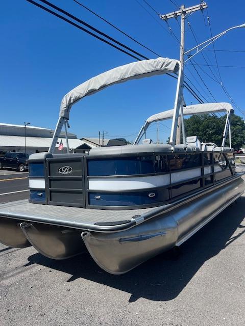 Bentley Pontoons 24 Legacy 2025 Bentley Pontoons 24 Legacy pontoon boat with canopy, parked on a sunny day.