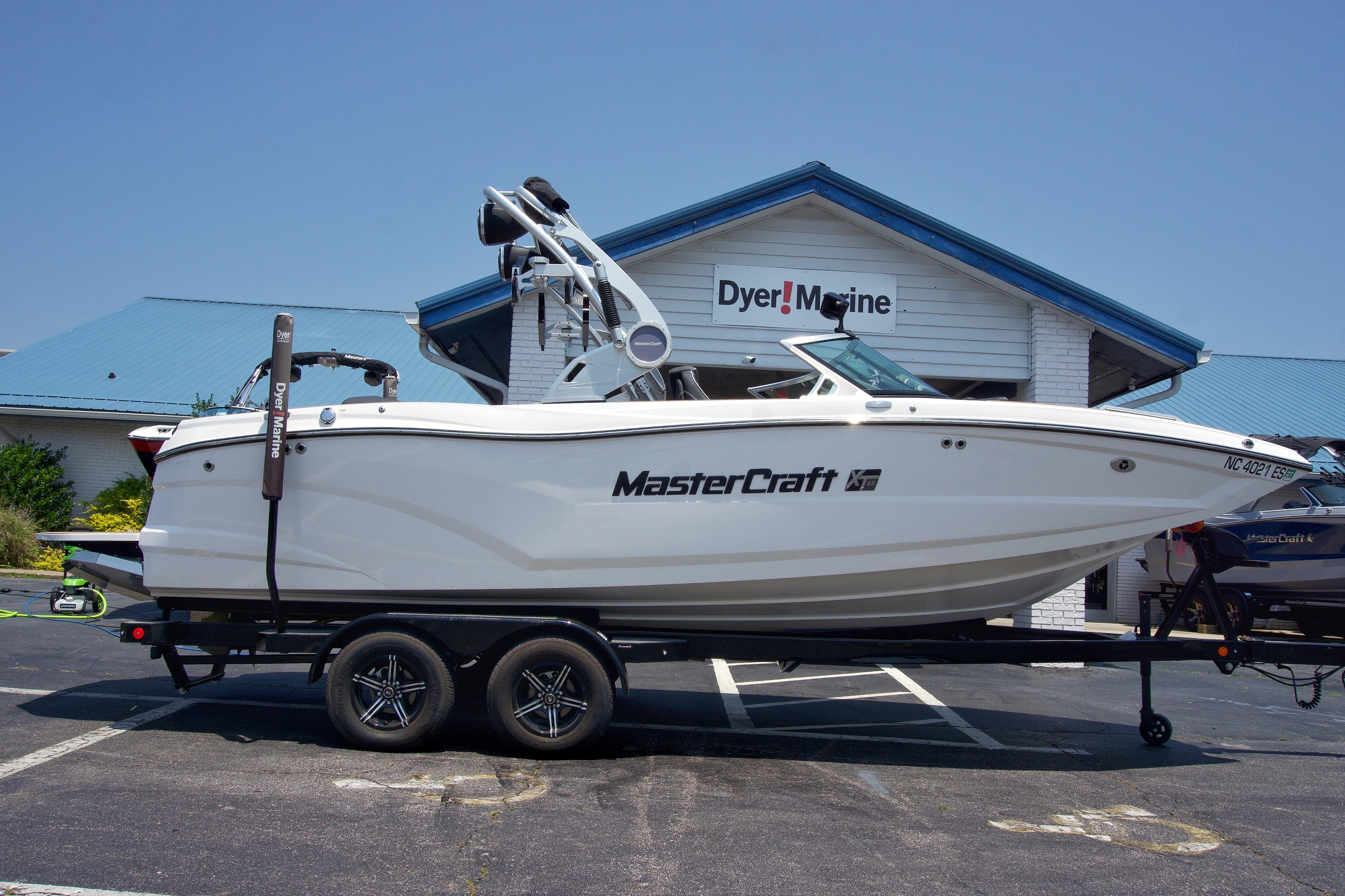 MasterCraft XT22 2021 MasterCraft XT22 boat on trailer at Dyer Marine dealership.