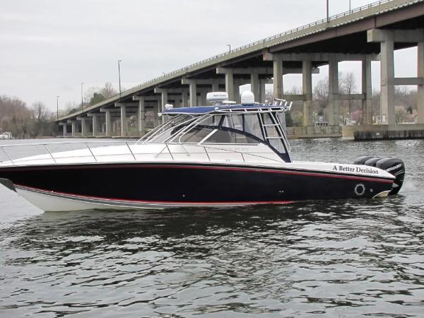 Fountain 38 Sportfish Cruiser OB 2008 Fountain 38 Sportfish Cruiser OB on water near a bridge.