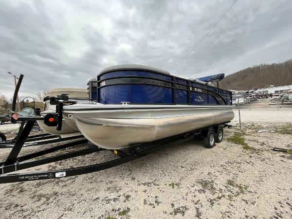 Bennington 22 SSLXP 2021 Bennington 22 SSLXP pontoon boat on a trailer, parked outdoors.