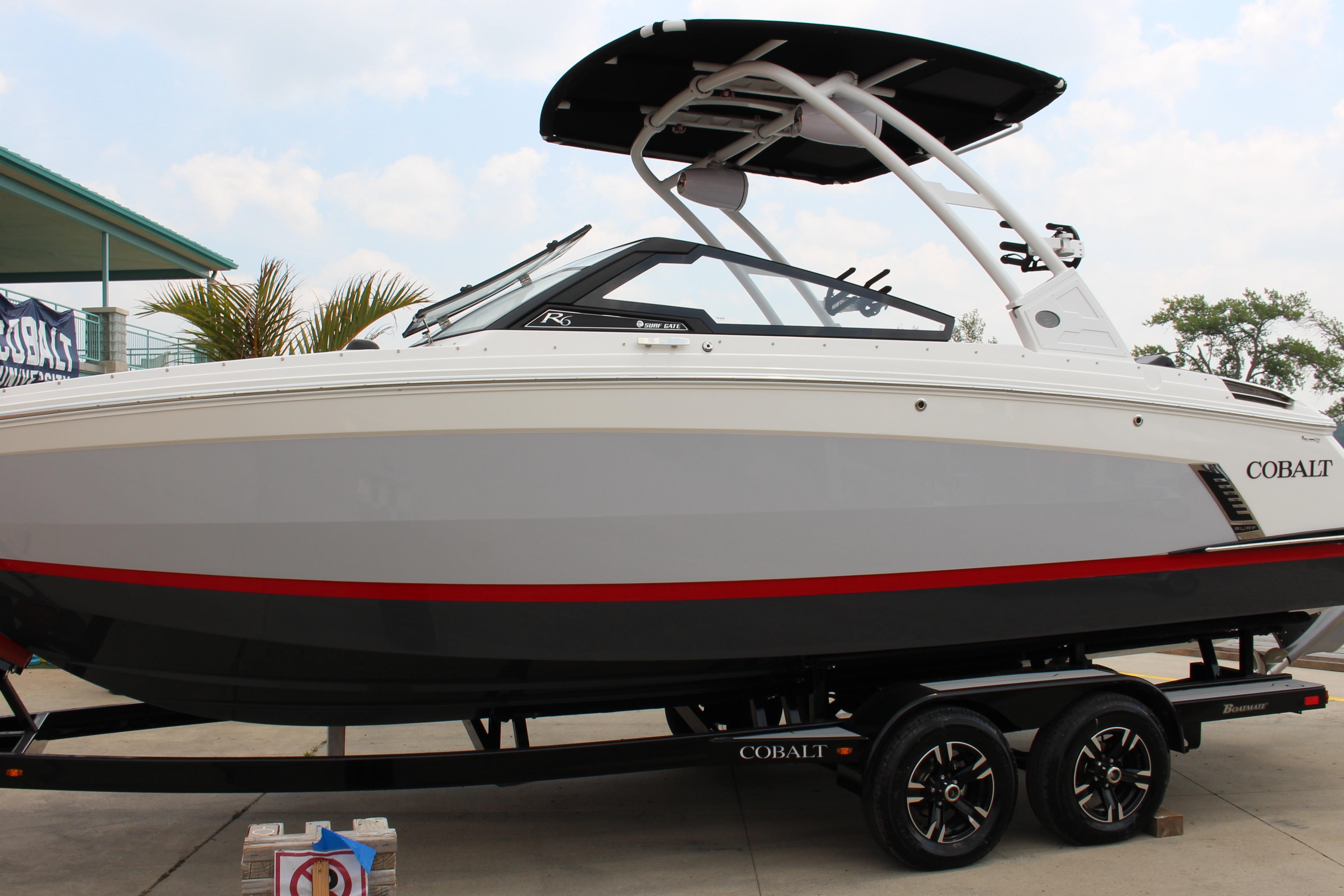 Cobalt R6 Surf 2024 Cobalt R6 Surf boat on trailer, featuring sleek design and modern features.