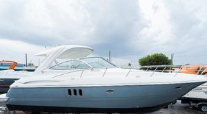 Cruisers 420 Express 2008 Cruisers 420 Express yacht with sleek design, docked under cloudy skies.