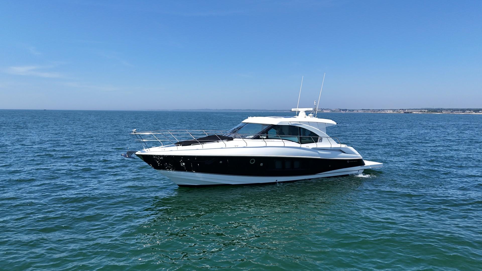Cruisers Yachts 45 Cantius 2015 Cruisers Yachts 45 Cantius on open water under clear blue sky.