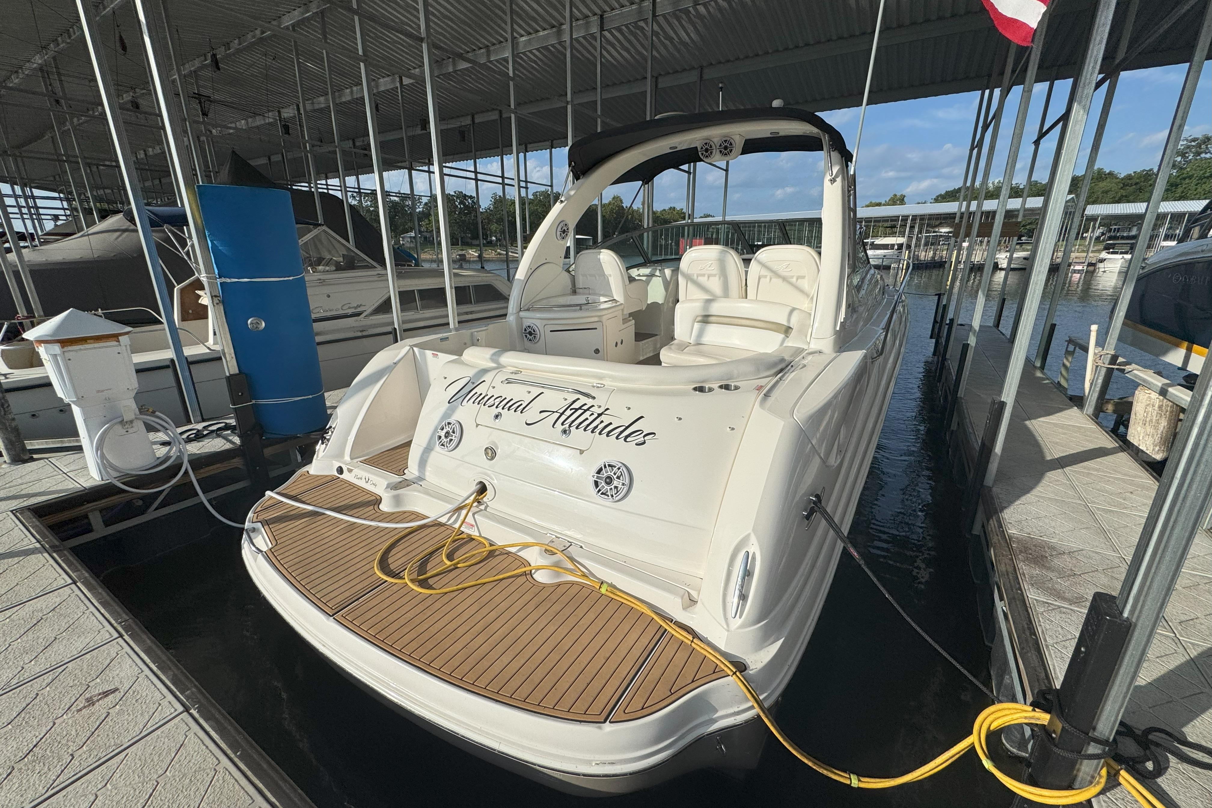Sea Ray 340 Sundancer 2006 Sea Ray 340 Sundancer docked in a marina, rear view with teak deck.