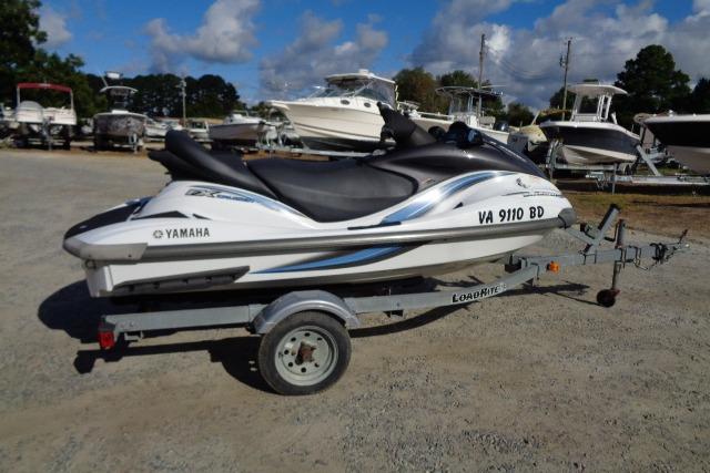 Yamaha WaveRunner FX Cruiser 2004 Yamaha WaveRunner FX Cruiser on trailer, parked in a boatyard under a cloudy sky.