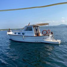 Menorquin 45 1990 Menorquin 45 boat on calm sea with scenic background.