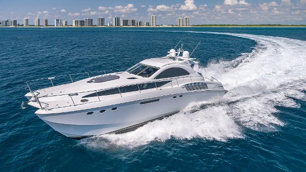 Custom 650 Catamaran Luxurious 2010 Custom 650 Catamaran cruising on open ocean near city skyline.