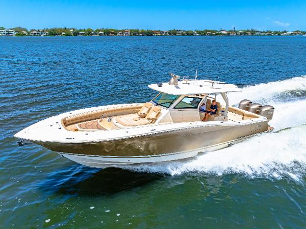 Scout 380 LXF 2018 Scout 380 LXF boat cruising on a sunny day.