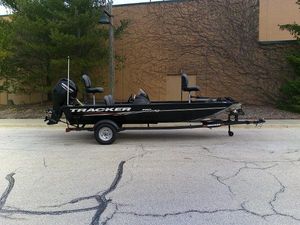 Tracker Pro 170 2025 Tracker Pro 170 boat on trailer, parked outdoors.