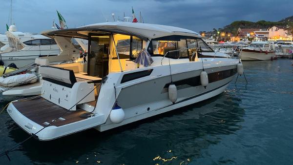 Jeanneau NC 37 2019 Jeanneau NC 37 yacht docked at marina during evening.