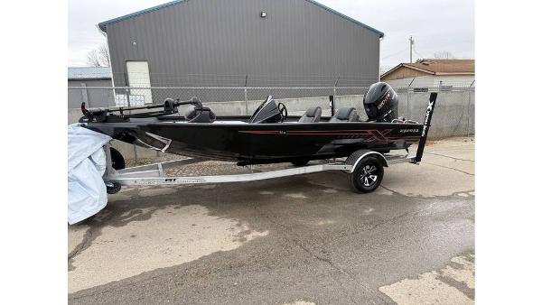 Xpress H18 2025 Xpress H18 boat on trailer, black exterior, parked outdoors.