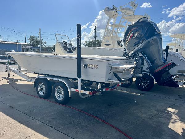 Hewes Redfisher 21 2025 Hewes Redfisher 21 boat on trailer with powerful outboard motor.