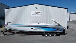 Baja 40 Outlaw 2004 Baja 40 Outlaw speedboat on trailer, parked outside a marine storage facility.