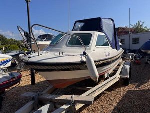 Kruger Beta 2 2019 Kruger Beta 2 boat on trailer, parked outdoors under clear sky.