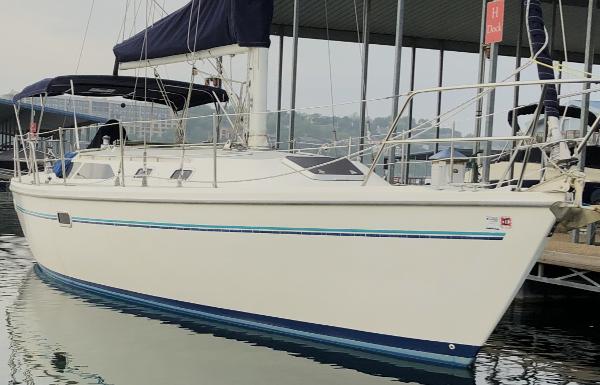Catalina 36 1994 Catalina 36 sailboat docked at marina, featuring sleek design and blue accents.