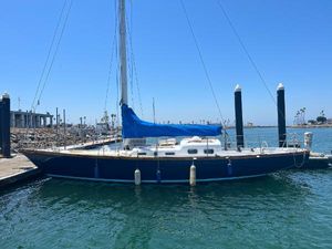 Van De Stadt Rebel 42 1977 Van De Stadt Rebel 42 sailboat docked in a marina under clear blue sky.