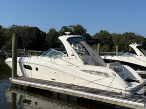 Sea Ray 350 Sundancer 2012 Sea Ray 350 Sundancer yacht docked at marina, surrounded by trees.