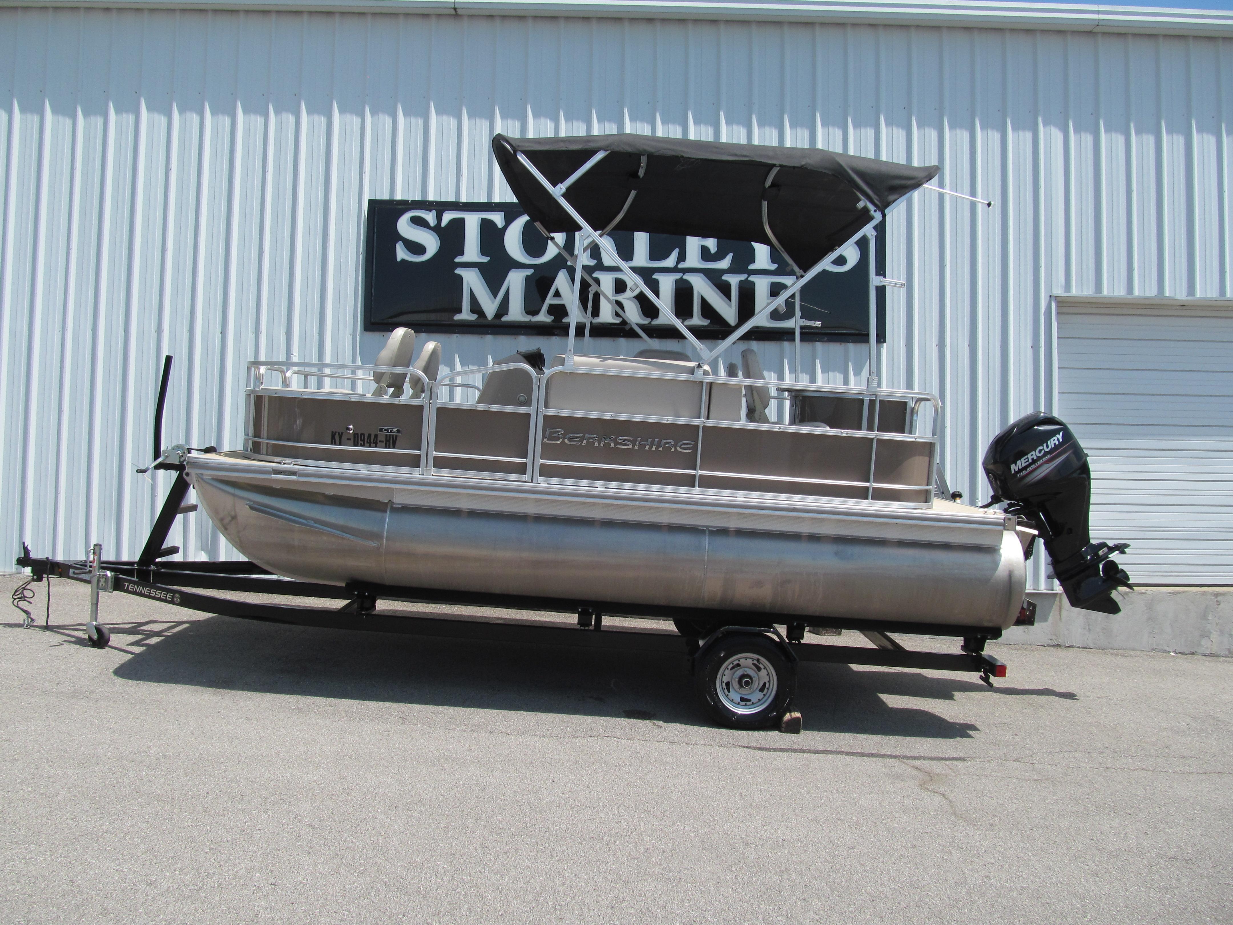 Berkshire 17A CTS 2018 Berkshire 17A CTS pontoon boat on trailer outside marine store.