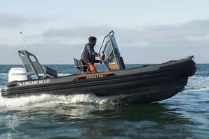 Highfield Patrol 540 Coaster 2025 Highfield Patrol 540 Coaster boat cruising on open water with Honda engine.