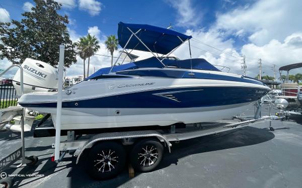 Crownline Eclipse E235 XS 2019 Crownline Eclipse E235 XS boat on a trailer under a blue sky.