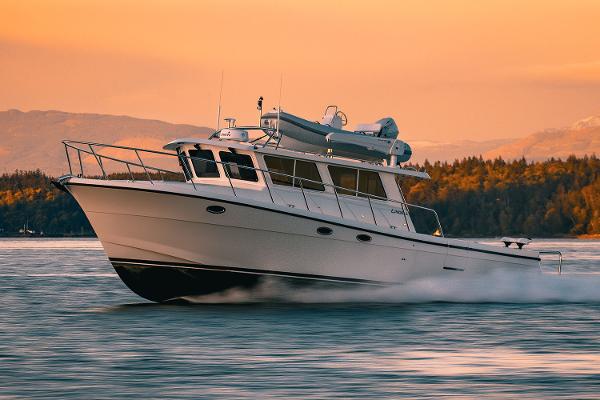 Lindell 42 Lindell 42 yacht cruising on water at sunset, 2025 model.