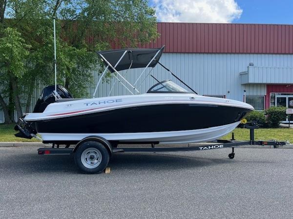 Tahoe 185 S 2024 Tahoe 185 S boat on trailer, black and white exterior, parked outdoors.
