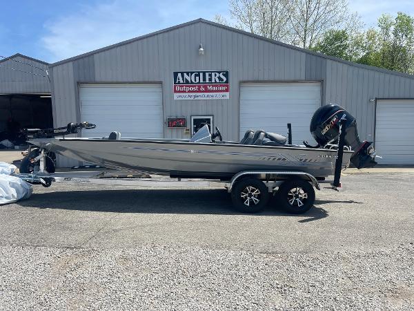 Xpress H20 2025 Xpress H20 boat on trailer outside Anglers Outpost & Marine building.