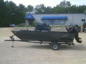 Lund 1650 Angler Tiller 2024 Lund 1650 Angler Tiller boat on trailer outside dealership.