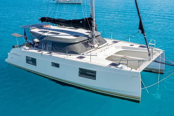 Nautitech 40 Open 2021 Nautitech 40 Open catamaran sailing on clear blue water.