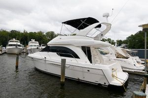 Meridian 381 Sedan 2003 Meridian 381 Sedan yacht docked at marina, overcast sky.