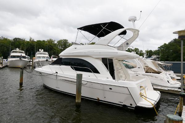 Meridian 381 Sedan 2003 Meridian 381 Sedan yacht docked at marina, overcast sky.